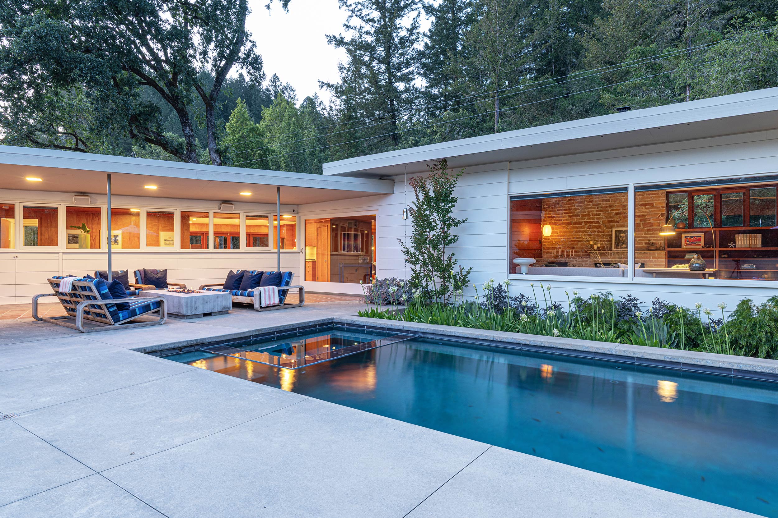 Modern Mid-century Forestville, CA pool area at dusk