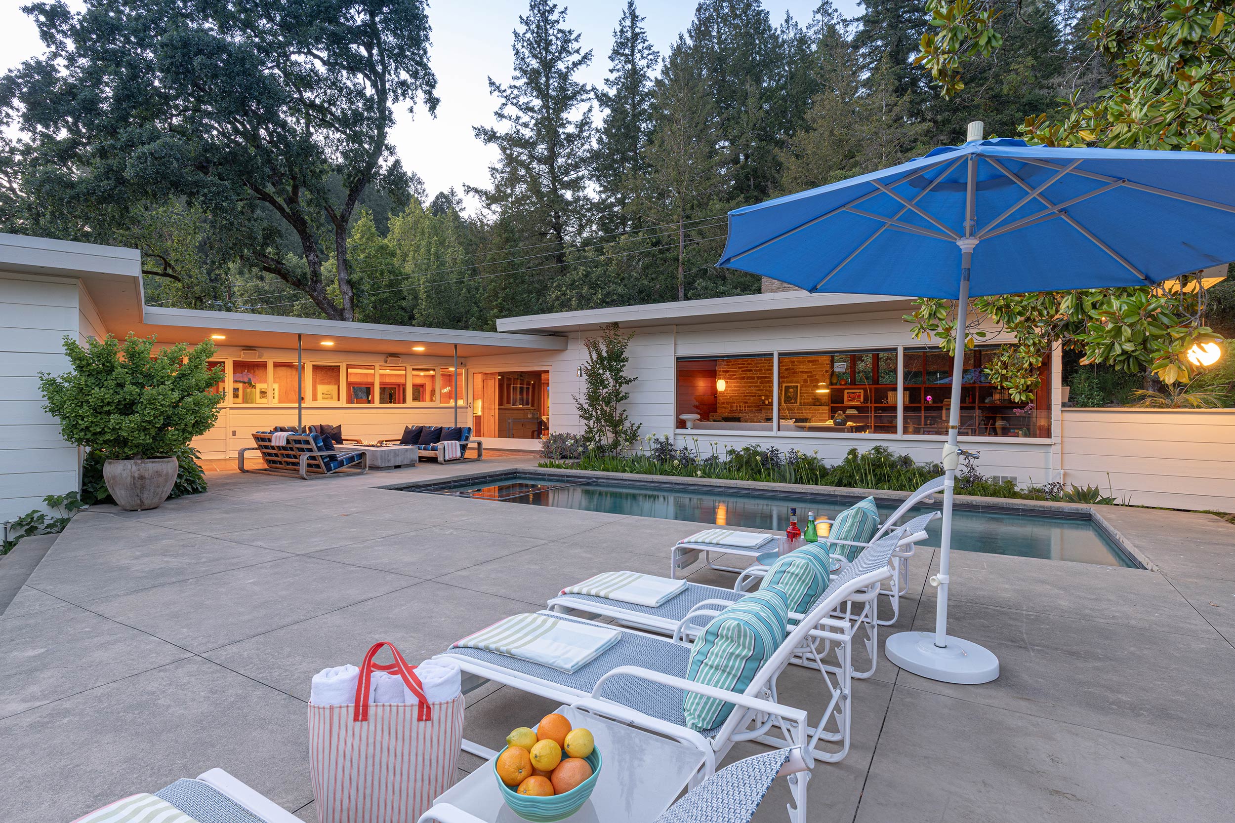 Modern Mid-century Forestville, CA exterior pool area and seating at dusk